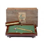 A NUKU BRASS MOUNTED MAHOGANY MINIATURE BILLIARD TABLE, C1900 with slated bed, on turned legs,