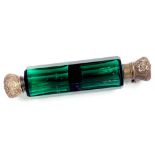 A VICTORIAN SILVER MOUNTED EMERALD GREEN GLASS COMBINATION SCENT/SALTS BOTTLE, CIRCA 1875 (HINGE
