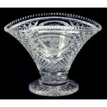 AN ENGLISH CUT GLASS VASE OF FLARED OVAL SHAPE, WHEEL ENGRAVED WITH A BASKET OF FLOWERS TO EITHER