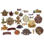 A COLLECTION OF LATE 19TH/EARLY 20TH CENTURY BRITISH ARMY METAL CAP BADGES, INCLUDING PETERBOROUGH