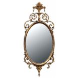 A GEORGE III STYLE GILT OVAL MIRROR, 110CM H