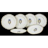 A SET OF SIX FRENCH PORCELAIN PLATES, PAINTED IN 'DRY' BLUE AND GILT WITH AN OVAL FRAMED MONOGRAM IN