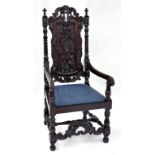 A VICTORIAN CARVED OAK ARMCHAIR IN CHARLES II STYLE, WITH LATER BOARDED SPLAT, BLACK PAINTED,