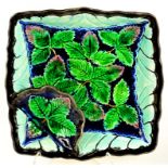 A CONTINENTAL MAJOLICA BRAMBLE MOULDED SQUARE DISH, 24CM DIAM, LATE 19TH CENTURY