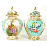 A PAIR OF GERMAN PORCELAIN OVIFORM VASES AND COVERS PAINTED WITH PANELS OF LOVERS ALTERNATING WITH