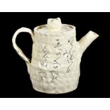 A CONTEMPORARY JAPANESE EARTHENWARE TEAPOT AND COVER WITH PAINTED INSCRIPTION, 18CM H, SIGNED