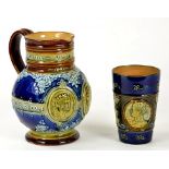 A DOULTON WARE COMMEMORATIVE JUG - DIAMOND JUBILEE 1897 AND A DOULTON WARE COMMEMORATIVE BEAKER -