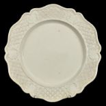 A STAFFORDSHIRE SALTGLAZED WHITE STONEWARE PLATE WITH MOULDED BORDER AND SHAPED RIM, 23CM DIAM,