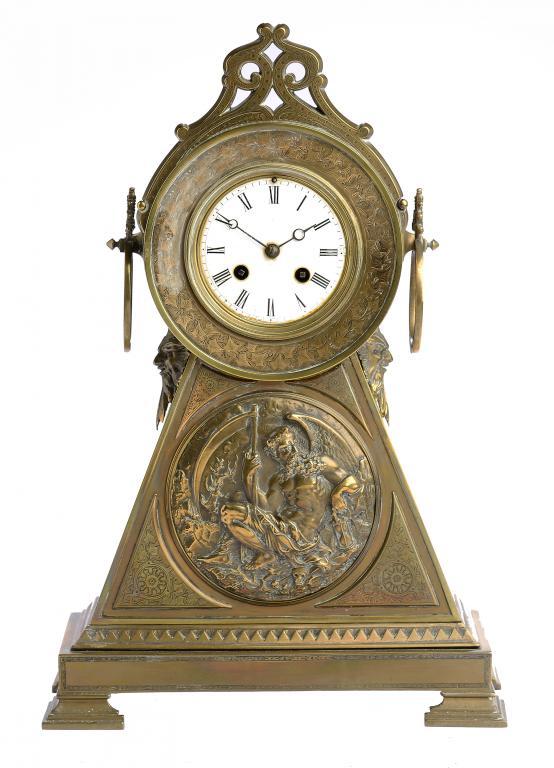 A FRENCH BRASS MANTLE CLOCK, C1890 the triangular base with a relief medallion of Father Time, the