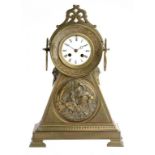 A FRENCH BRASS MANTLE CLOCK, C1890 the triangular base with a relief medallion of Father Time, the