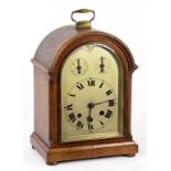 A GERMAN OAK BRACKET CLOCK, THE SILVERED DIAL WITH TWIN SUBSIDIARY DIALS TO THE ARCH, THE MOVEMENT