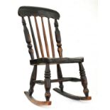 A VICTORIAN ASH CHIILDS ROCKING CHAIR WITH ELM SEAT