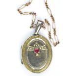 A GOLD LOCKET, APPLIED WITH A GEM SET CLUSTER, ON A GOLD NECKLET, 17G GROSS