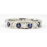 A SAPPHIRE AND DIAMOND NINE STONE RING IN WHITE GOLD, MARKED 18K 760, 5G GROSS