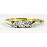 A DIAMOND THREE STONE RING, IN GOLD, MARKED 18CT