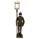 A CAST IRON FIGURAL LAMP IN THE FORM OF A SUITE OF ARMOUR, WITH FROSTED GLASS SHADE, 93CM H, MID