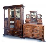 AN EDWARDIAN STAINED WALNUT WARDROBE WITH MIRRORED DOORS AND MATCHING DRESSING TABLE WITH BRASS