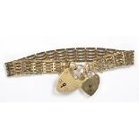 A 9CT GOLD GATE BRACELET WITH TWO 9CT GOLD PADLOCKS, 19G