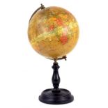 A GEOGRAPHIA LTD 8" TERRESTRIAL GLOBE IN LACQUERED BRASS HALF MERIDIAN, ON TURNED AND EBONISED