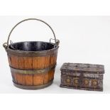 A BRASS BOUND OAK BUCKET WITH SWING HANDLE AND METAL LINER, 25CM H AND AN ORNAMENTAL BRASS STUDDED