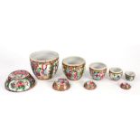 A GRADUATED SET OF FIVE CHINESE PORCELAIN CANTON FAMILLE ROSE BOXES AND FOUR COVERS, LARGEST 12CM H,