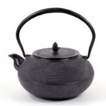 TEA CEREMONY. A JAPANESE CAST IRON KETTLE AND COVER, 22CM H