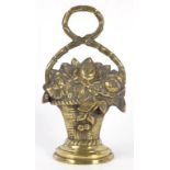 A VICTORIAN CAST BRASS BASKET OF FLOWERS DOORSTOP, 33CM H