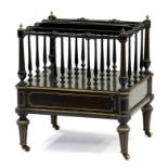 A VICTORIAN EBONISED MAHOGANY AND GILTMETAL MOUNTED CANTERBURY