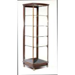 AN EDWARD VII MAHOGANY FLOOR STANDING BOW FRONTED SHOWROOM CABINET with adjustable metal brackets,