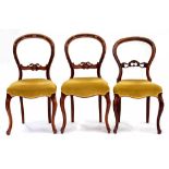 ONE AND A PAIR OF WALNUT BALLOON BACK DINING CHAIRS