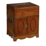 A REGENCY SATINWOOD AND CROSSBANDED COLLECTOR'S CABINET, C1820 with lidded top, the doors to the