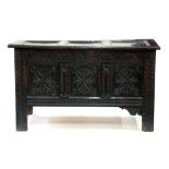 A LATE 17TH C CARVED OAK BLANKET CHEST WITH PANELLED LID, 128CM W