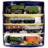 A HORNBY CLOCKWORK O GAUGE LOCOMOTIVE AND TENDER AND THREE WAGONS, IN HORNBY BOX AND TWO OTHER