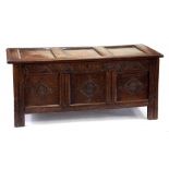 A CARVED OAK BLANKET CHEST WITH PANELLED LID DATED 1961), 130CM W