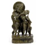 AN INDIAN GREEN SOAPSTONE CARVING OF RADHA AND KRISHNA, 26CM H