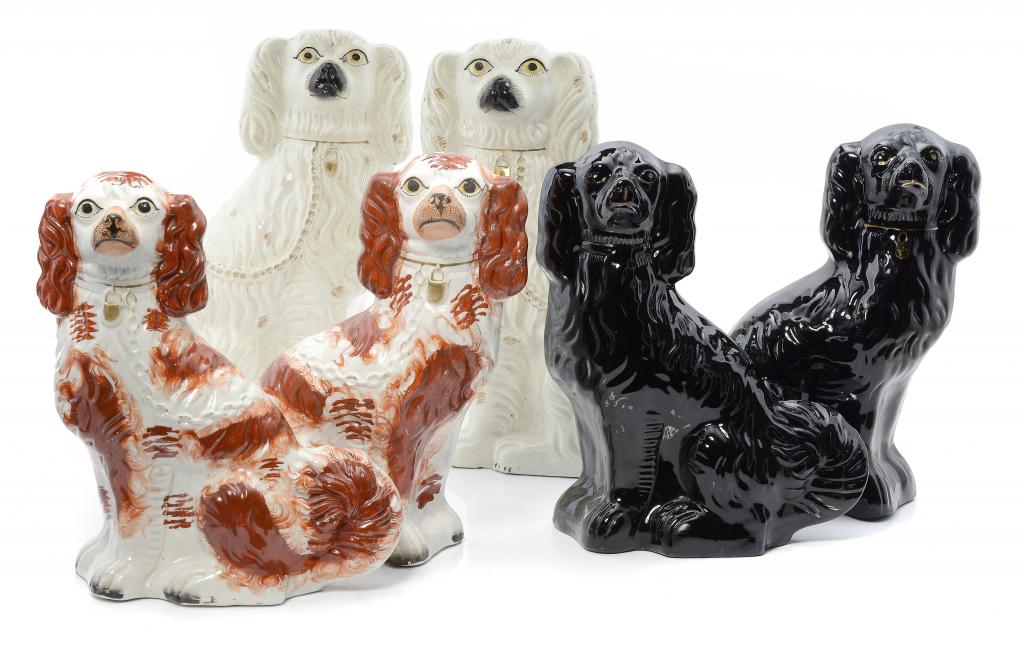 THREE PAIRS OF STAFFORDSHIRE EARTHENWARE MODELS OF SPANIELS, 19TH C 32 and 38cm h ++The lot in