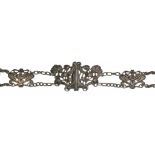 AN ART NOUVEAU SILVER BELT with cast openwork panels and clasp, 74cm l, by Horton & Allday,