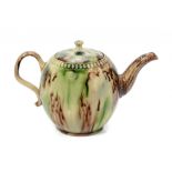 A STAFFORDSHIRE CREAMWARE GLOBULAR TEAPOT AND COVER, C1770-80 with underglaze oxide decoration, 10cm