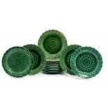 SEVENTEEN WEDGWOOD GREEN GLAZED EARTHENWARE SUNFLOWER MOULDED PLATES, MID 19TH C AND LATER 22cm