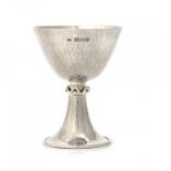 AN OMAR RAMSDEN SILVER WINE CUP 9.5cm h, maker's mark engraved, under the foot OMAR RAMSDEN ME