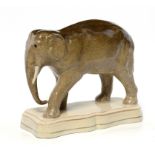 A STAFFORDSHIRE EARTHENWARE MODEL OF AN ELEPHANT, C1860 16cm h ++Some professional restoration