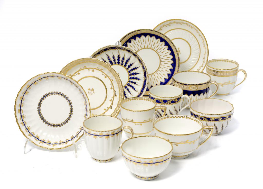 THREE DERBY GILT OR BLUE AND GILT TRIOS AND TWO CUPS AND SAUCERS, C1790-95 saucers 12.5-13.5cm diam,