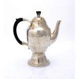 A GEORG JENSEN SILVER COFFEE POT AND COVER, DESIGNED 1910, MANUFACTURED 1915-19 24cm h, control