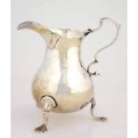 A GEORGE III SILVER BALUSTER CREAM JUG, ON THREE FEET, 10.5CM H,. LONDON 1769, 3OZS