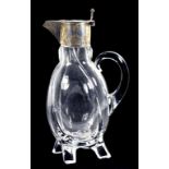 A VICTORIAN SILVER MOUNTED GLASS CLARET JUG, ON FOUR FEET, 24CM H, BIRMINGHAM 1893