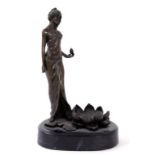 AN ART NOUVEAU STYLE BRONZE SCULPTURE OF A MAIDEN STANDING BESIDE A WATERLILY, SLATE PLINTH, 25CM H