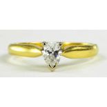 A PEAR SHAPED DIAMOND SOLITAIRE RING IN 18CT GOLD, 3.5G GROSS