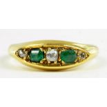 AN EMERALD AND DIAMOND FIVE STONE RING IN GOLD, MARKED 18CT, 5.5G GROSS