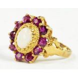 A RUBY AND OPAL CLUSTER RING IN 9CT GOLD, 3.8G GROSS