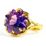 A 22CT GOLD WEDDING RING, ADAPTED AND SET WITH AN AMETHYST, 5.8G GROSS